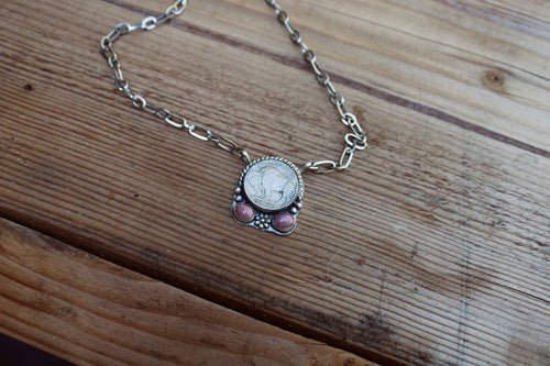 Buffalo coin with pink rhodonite