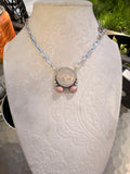 Buffalo coin with pink rhodonite