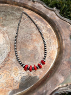 red coral and stainless steel graduated beaded necklace