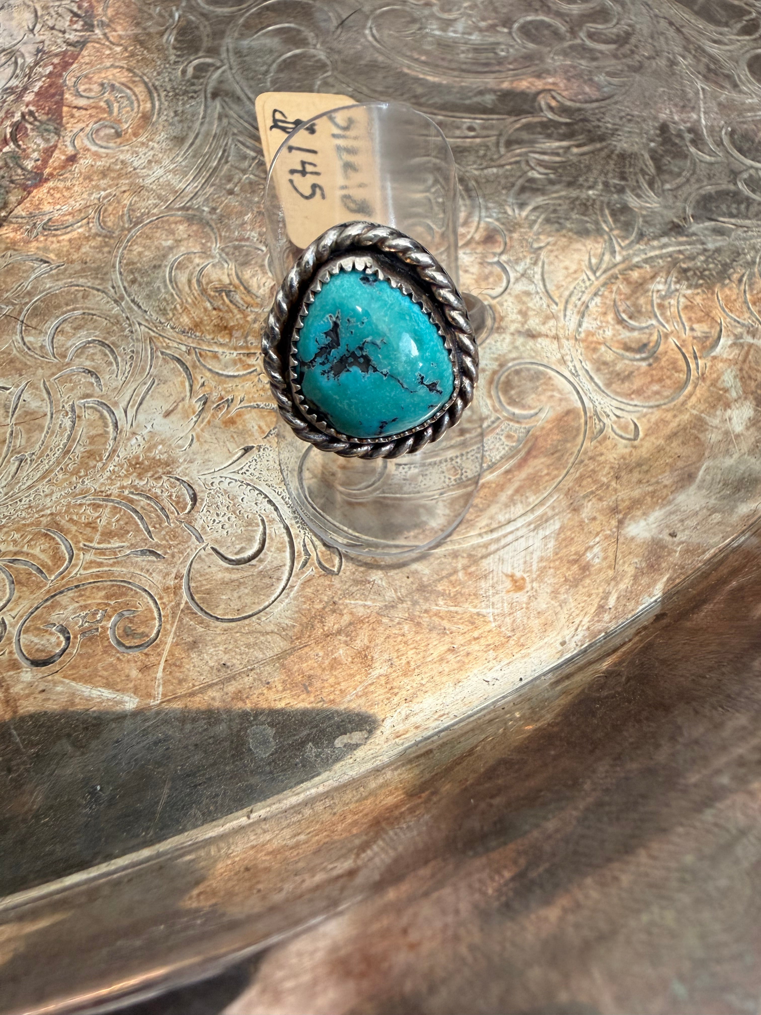 rough shape turquoise ring with roping